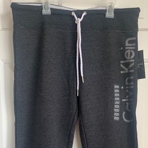 NWT, Calvin Klein, dark grey draw string joggers.